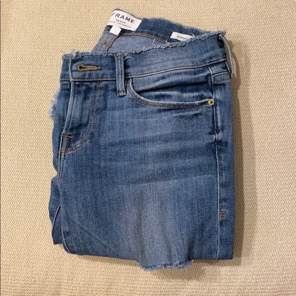 Frame size 25 tight fit low rise washed jeans